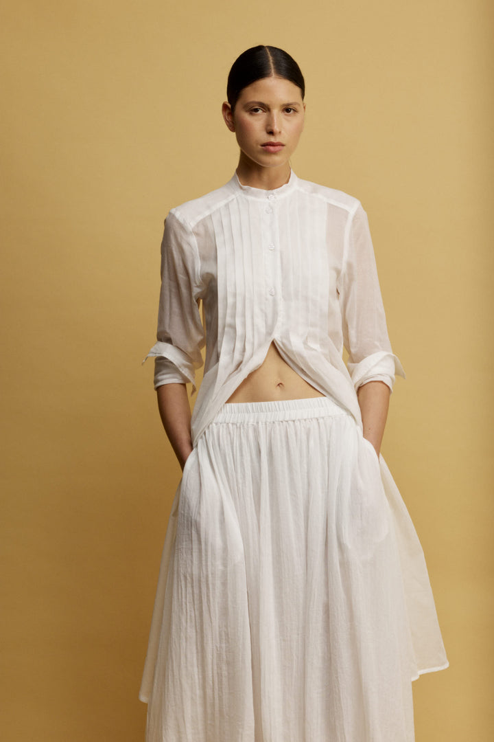 Roly חצאית מידי לבנה בעלת כיסים וסיומת מלמלה א-סימטרית מבד נעים משכית