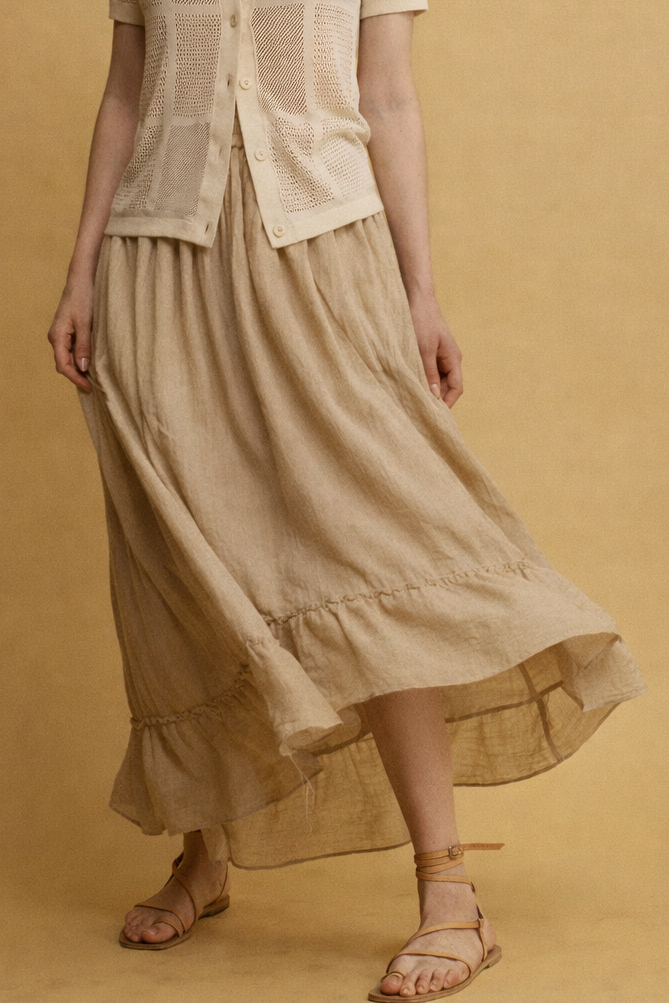 Roly חצאית מידי בז' בעלת כיסים וסיומת מלמלה א-סימטרית מבד נעים משכית